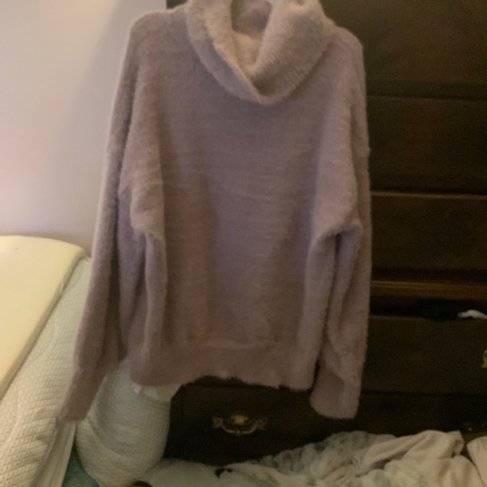 An adorable fuzzy sweater. Lightweight but toasty